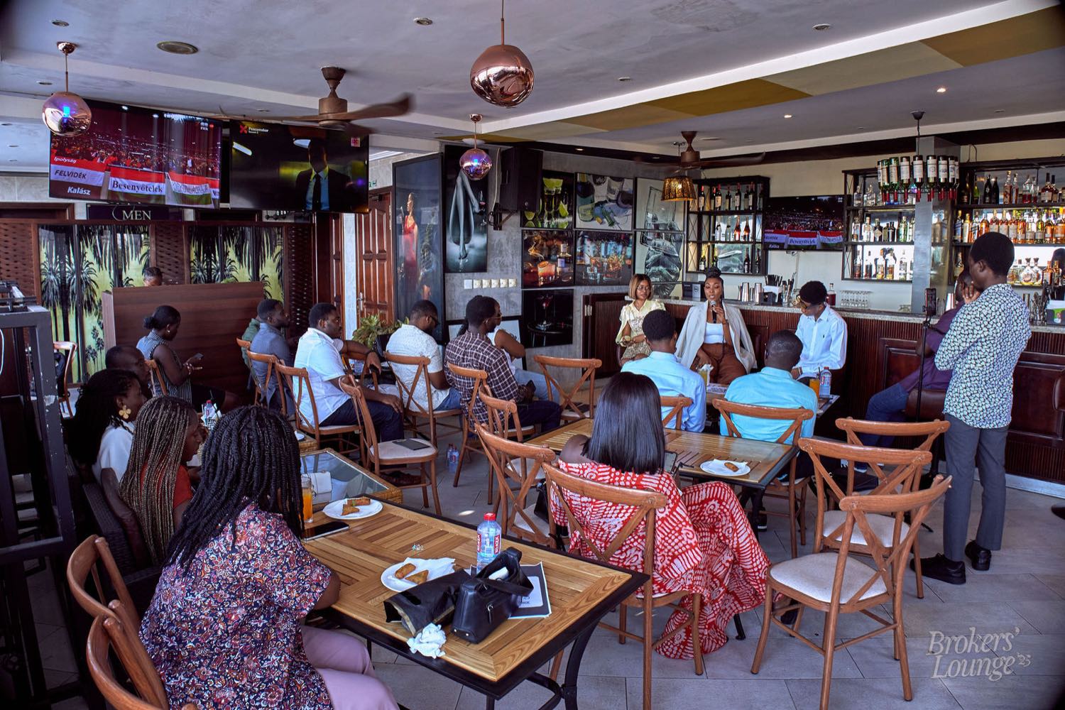 Guests in conversation at a Prime Exchange gathering in Accra